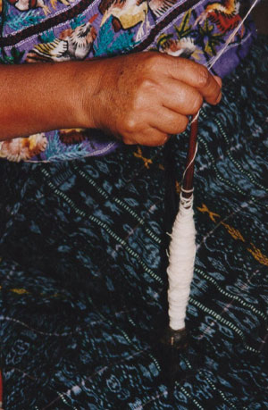 Guatemalan Woman Winding Spun Cotton Thread Around a Spindle